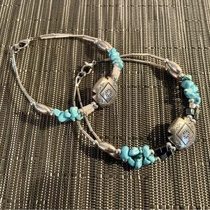 Two matching turquoise and silver bracelets